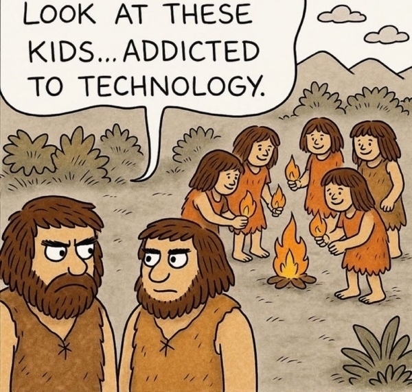 Twee mannen met een boze uitdrukking kijken naar kinderen die rond een vuurtje staan en met vlammen spelen in een prehistorische omgeving met heuvels en bomen. Een van de mannen zegt Look at the kids playing with technology